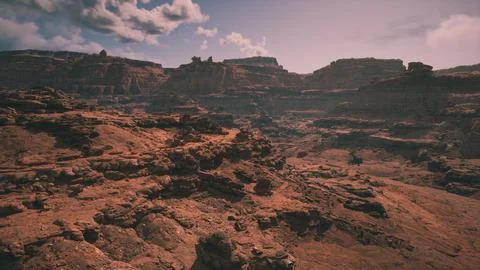 Dramatic landscape of rugged cliffs and rocky terrain at golden hour Stock-Illustration