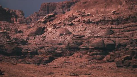 Dramatic landscape of rugged rock formations under clear sky during daytime Stock Illustration
