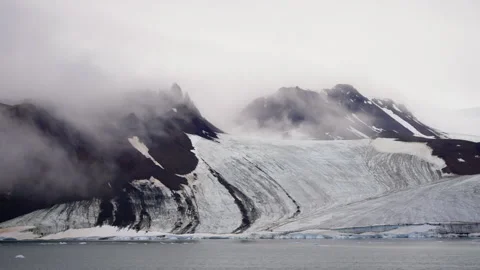 Dramatic Landscape of Rugged Snow-Capped Mountains and Glacial Formations Stock Footage 312209440