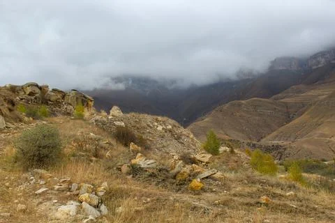 Dramatic landscape - steep cliffs and green hills in the Elbrus region, Russi Stock Photos