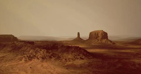 Dramatic landscape with towering rock formations in a desert setting Stock Illustration