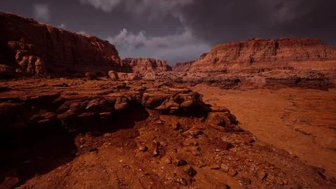 Dramatic landscape under dark clouds in a vast desert region during afternoon Stock Illustration