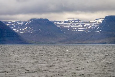 Dramatic landscape view of mountains and sea in Iceland, near Isafjordur, under Stock Photos