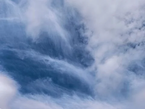 Dramatic Layered Clouds Over Open Blue Horizon Stock Photos