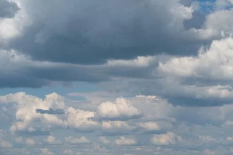 Dramatic layered cumulus clouds across a blue sky Stock Photos