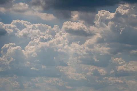 Dramatic layered cumulus clouds under moody sky Stock Photos