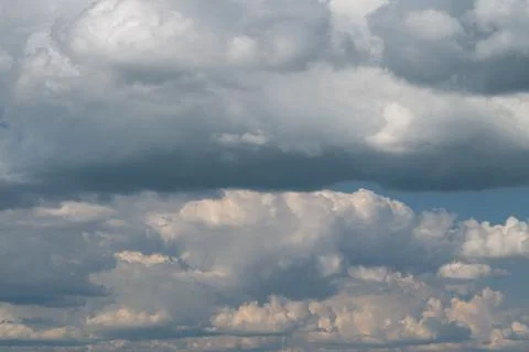 Dramatic layered storm clouds filling a wide summer sky Stock Photos