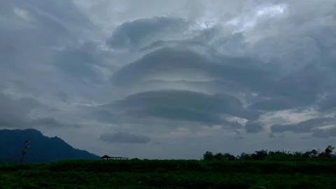 Dramatic Lenticular Cloud Formation Over Rural Landscape and Mountains Stock-Footage 337048112