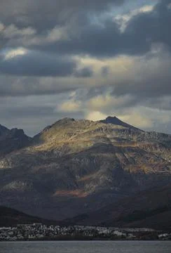 Dramatic light and clouds over mountain peaks around Tromso northern norway Stock Photos