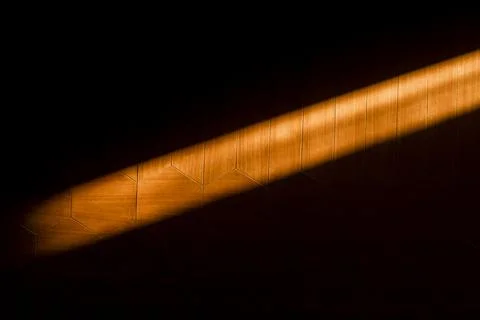 Dramatic Light Beam on Hexagonal Wood Paneling:  Abstract Texture Background Stock Photos