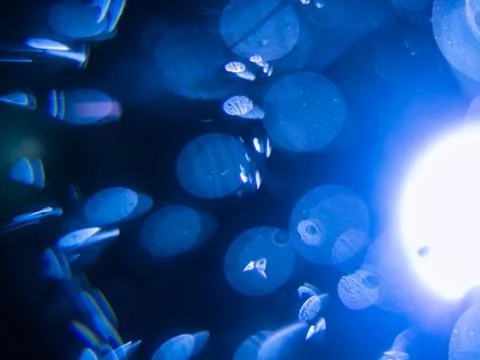 Dramatic light effect with blurry blue background. Stock Photos