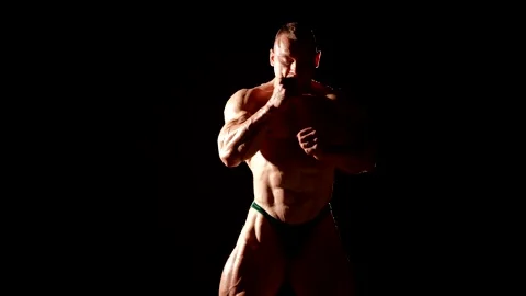 Dramatic light highlights every curve and relief of the muscles. Stock Footage 297610625