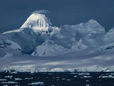 Dramatic light on the ice and glaciers on Anvers Island from Gerlache Strait, Stock Photos