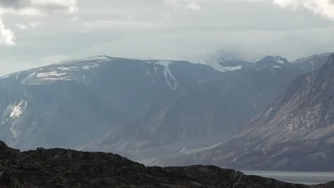 Dramatic Light Over Rugged Mountains in Uummannaq Greenland Stock-Footage 345613625