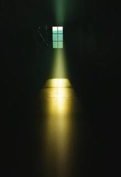 Dramatic light ray through window Foto stock