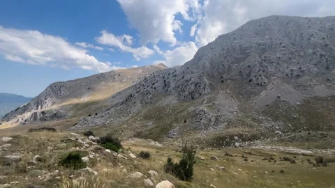 Dramatic Light on Rocky Mountain Landscape with Trees Stock Footage 343830423