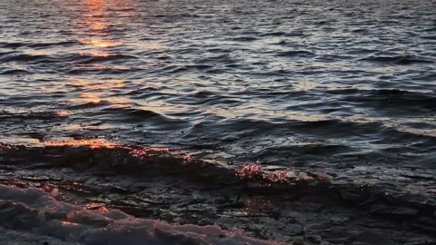 Dramatic light in the sea against the backdrop of city. Beautiful background Stock Footage 143379850
