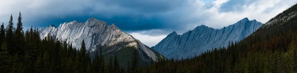 Dramatic light with silhouette of mountains Stock Photos