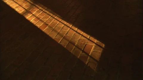 Dramatic light stock footage on brick floor with shadow ominous foreboding  스톡 동영상 71416315