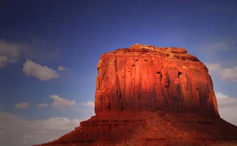 Dramatic light striking a rock formation in monument valley Stock Photos