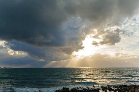Dramatic Light with Sun Rays and Heavy Clouds Stock Photos