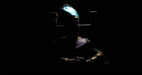 Dramatic lighting, ancient pharaoh is sitting on a throne in the dark, 4k Stock Footage 135648268