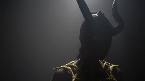 Dramatic lighting, evil demon woman with big horns, silhouette Stock Footage 115315426