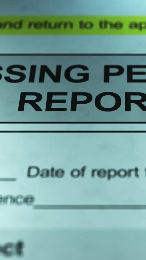 Dramatic Lighting over Generic Missing Person Report Form - Vertical Stock Footage 328508559