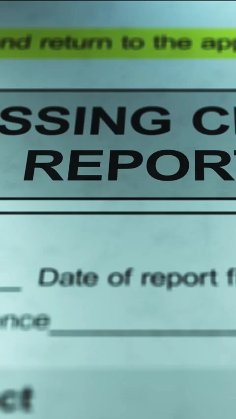 Dramatic Lighting over Generic Missing Child Report Form - Vertical Stock Footage 328508560