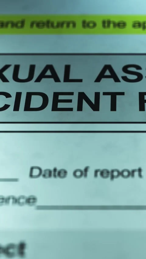 Dramatic Lighting over Generic Sexual Assault Incident Form - Vertical Stock Footage 328508569