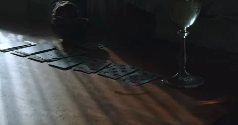 Dramatic lighting on a person playing solitaire. Stock Footage 206473291