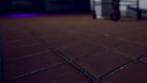 Dramatic Lighting Reveals Textured Tiles in a Dimly Lit Indoor Space Stock Footage 347253953