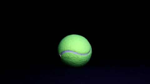 Dramatic Lighting Tennis Ball Against Black Background Stock Footage 249356160
