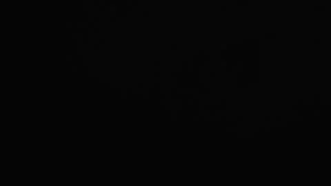 Dramatic lightning bolt illuminates dark sky during intense thunderstorm Stock Footage 316477370