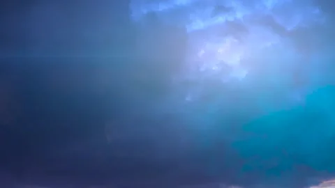 Dramatic Lightning Bolts Striking Through Stormy Blue Sky Stock Footage 345095829