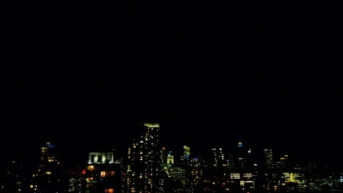 Dramatic lightning flashes behind dark Toronto city Stockbeeldmateriaal 347533232
