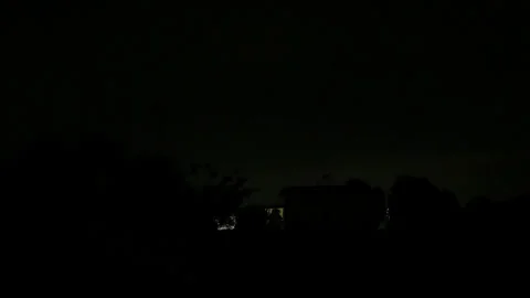Dramatic Lightning Flashes Illuminating the Night Sky During a Severe Thundersto Stock Footage 337561089