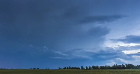Dramatic lightning storm clouds in the evening sky Stock Footage 146024352