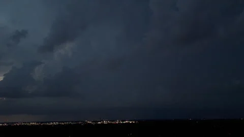 Dramatic lightning strike illuminating dark storm clouds during a powerful Video stock 347575857