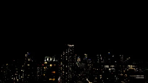 Dramatic lightning strikes illuminate the dark night sky over the Toronto 動画素材 347680392