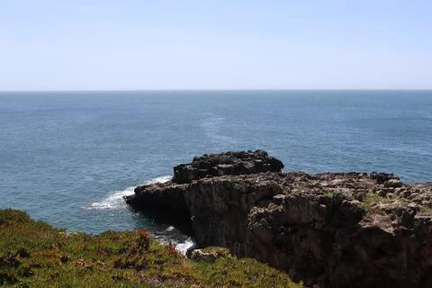 Dramatic limestone cliffs and Atlantic Ocean view in Cascais, Portugal. Stock Photos