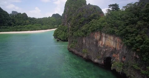 Dramatic Limestone Cliffs at Phra Nang Beach, Railay, Krabi, Thailand, Aerial Ap Stock-Footage 76489587