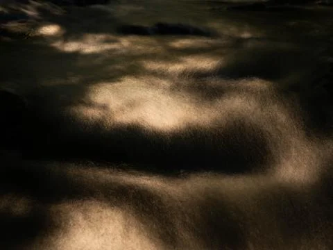 Dramatic Long Exposure of a Forest Stream in Sunlight Stock Photos