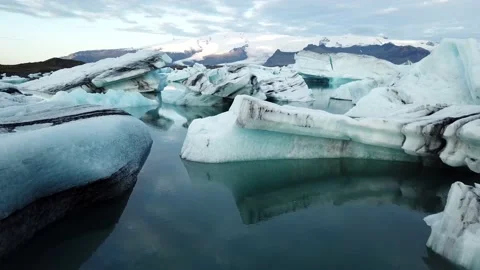 Dramatic Low Aerial Over Icebergs in Glacier Lagoon, Iceland Stock Footage 145907053