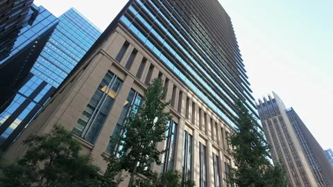 Dramatic low-angle perspective of the towering buildings around Marunouchi Stock Footage 295662297