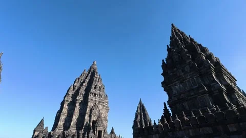 Dramatic low-angle view of multiple Prambanan Temple spires reaching upward.. Video stock 341542649