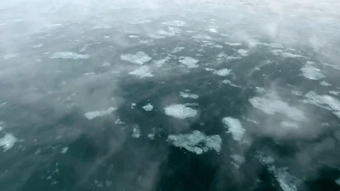 Dramatic low flight above Angara river fog.  Extreme cold winter snow blizzard Video stock 88464785
