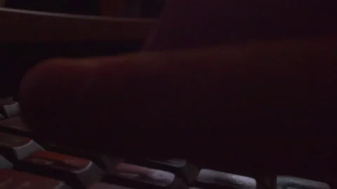 Dramatic macro shot of fingers typing on computer keyboard at night Stock Footage 335635759