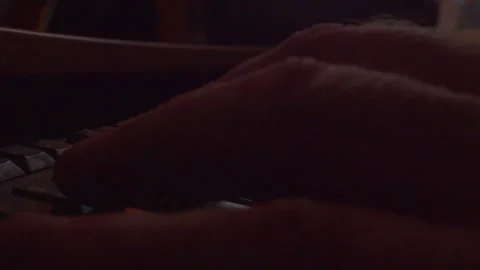 Dramatic macro shot of fingers typing on computer keyboard at night Stock Footage 335636029