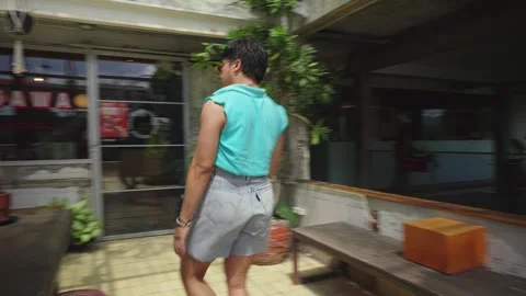 Dramatic Male Model Posing Boldly on Table Stock Footage 278661920